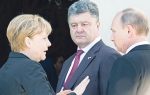 Merkelova,  Porošenko i Putin