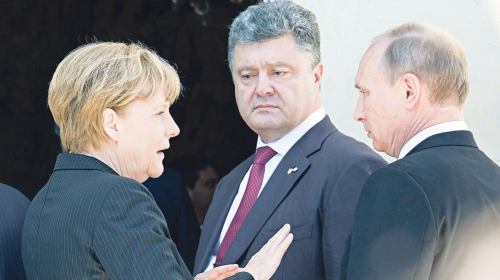 Merkelova,  Porošenko i Putin